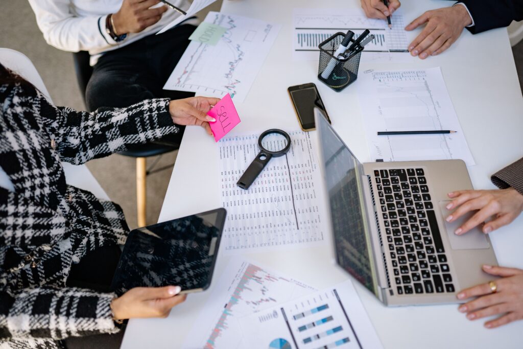 Business professionals collaborating on financial data analysis in a modern office setting.